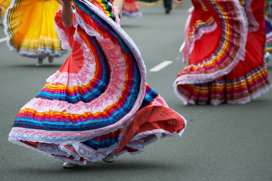 *   When is Hispanic Heritage Month celebrated? by Hispanic Month woman wearing red and pink floral dress