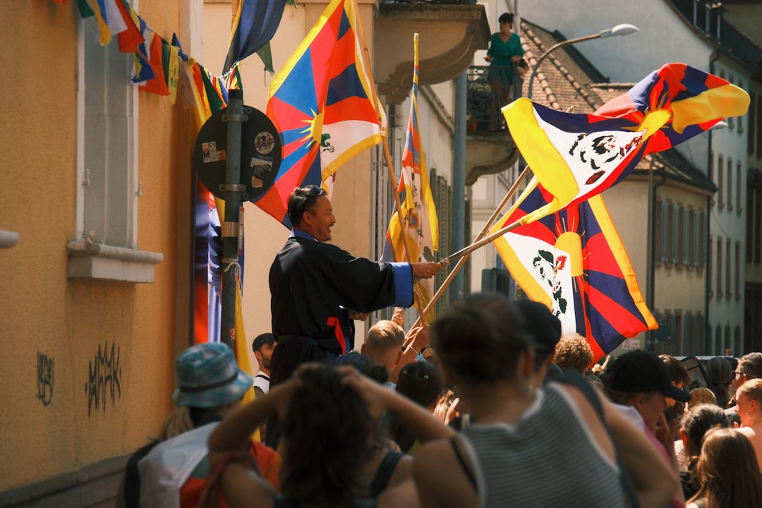 Conclusion: Carrying the Spirit of Hispanic Heritage Month Forward by Hispanic Month a crowd of people walking down a street holding flags