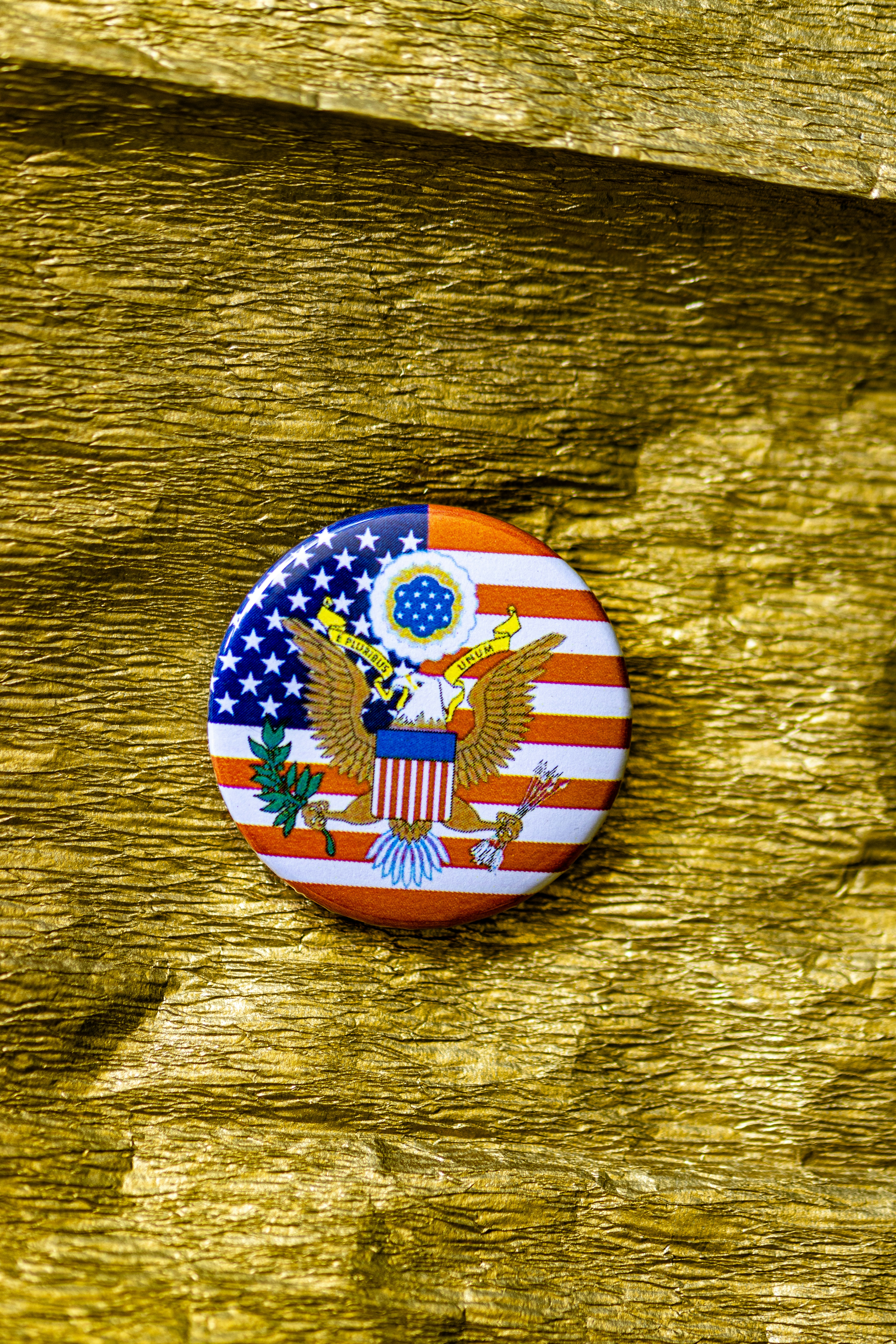 A picture of an american flag on a wooden surface